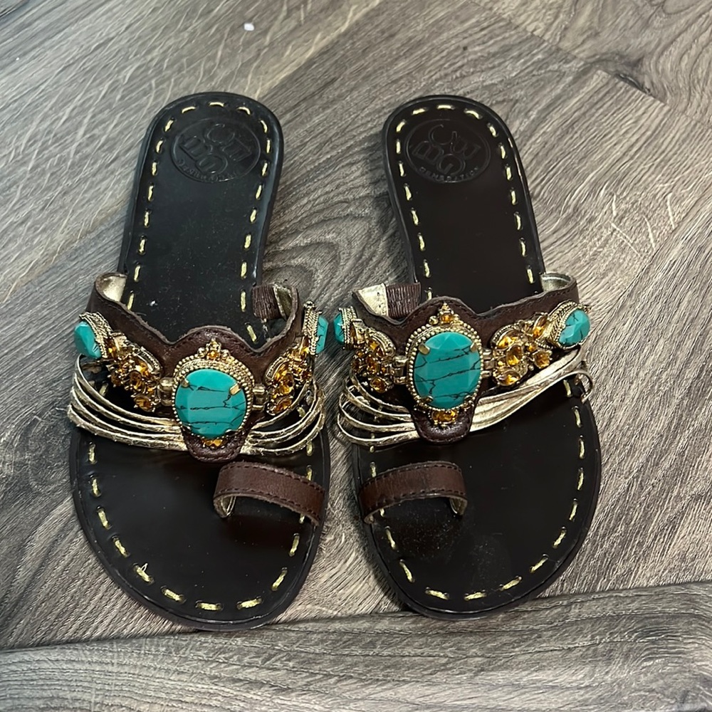 Brown sandals with blue and gold jewels